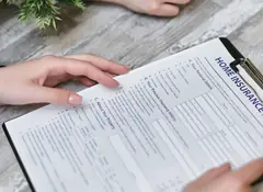 Home insurance claim form on a clipboard