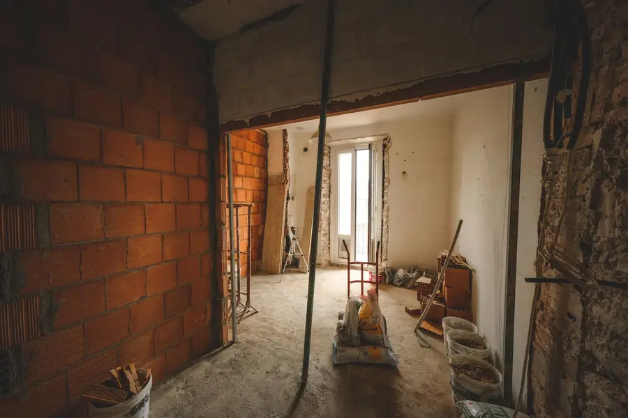 Room stripped back to brick and framing during a repair after water damage